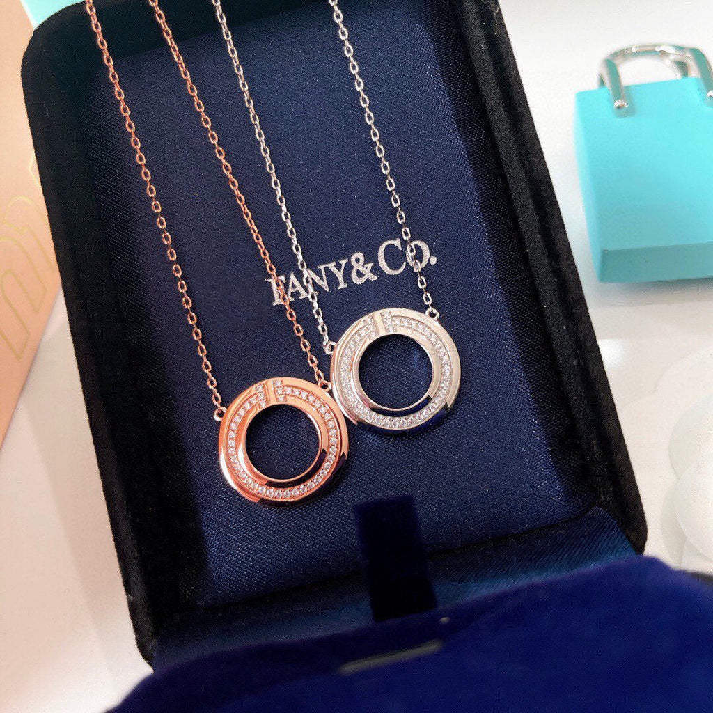 TIFFANY & CO. DIAMOND AND MOTHER OF PEARL CIRCLE PENDANT