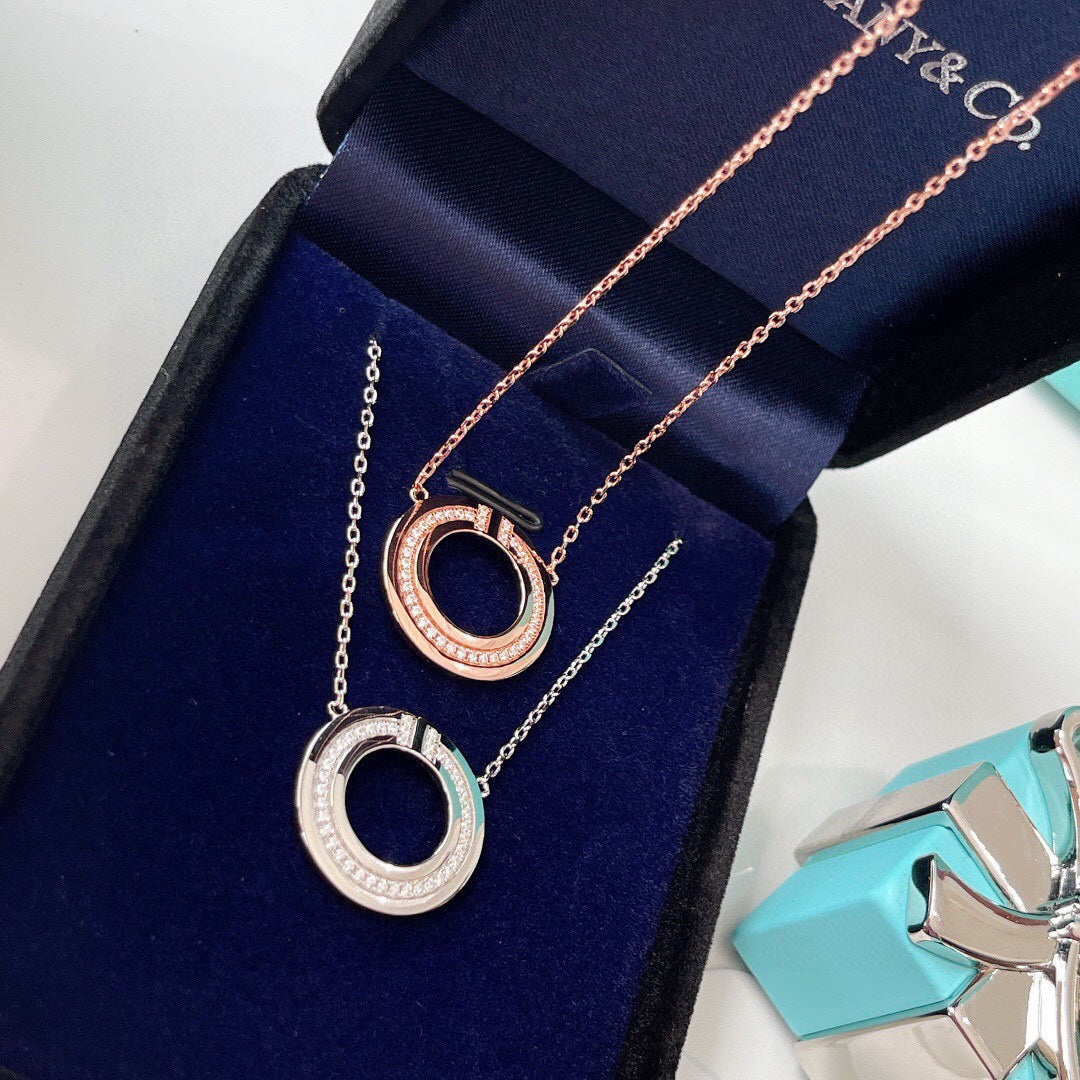 TIFFANY & CO. DIAMOND AND MOTHER OF PEARL CIRCLE PENDANT