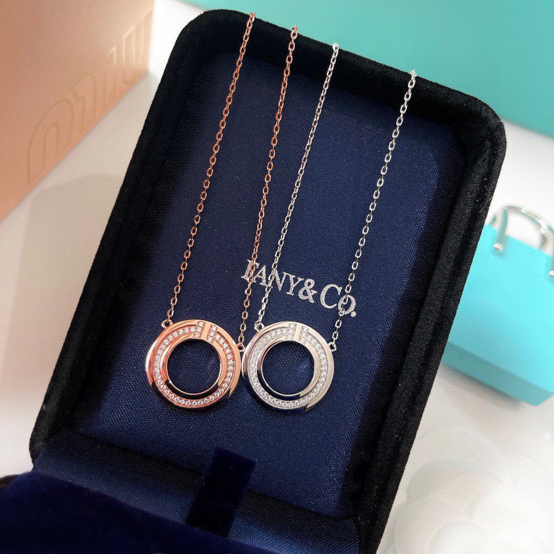 TIFFANY & CO. DIAMOND AND MOTHER OF PEARL CIRCLE PENDANT
