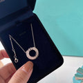 TIFFANY & CO. DIAMOND AND MOTHER OF PEARL CIRCLE PENDANT