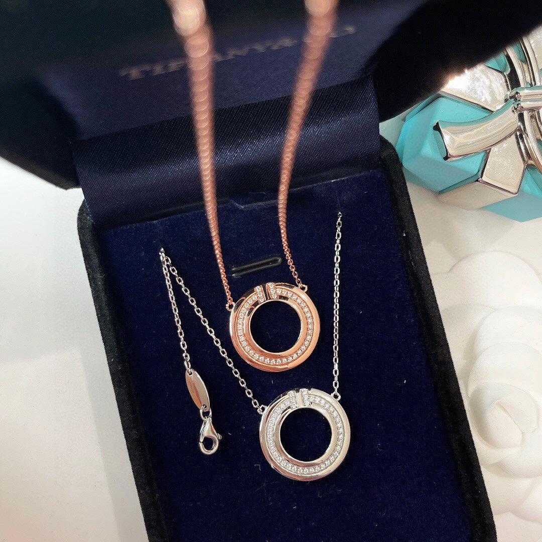 TIFFANY & CO. DIAMOND AND MOTHER OF PEARL CIRCLE PENDANT